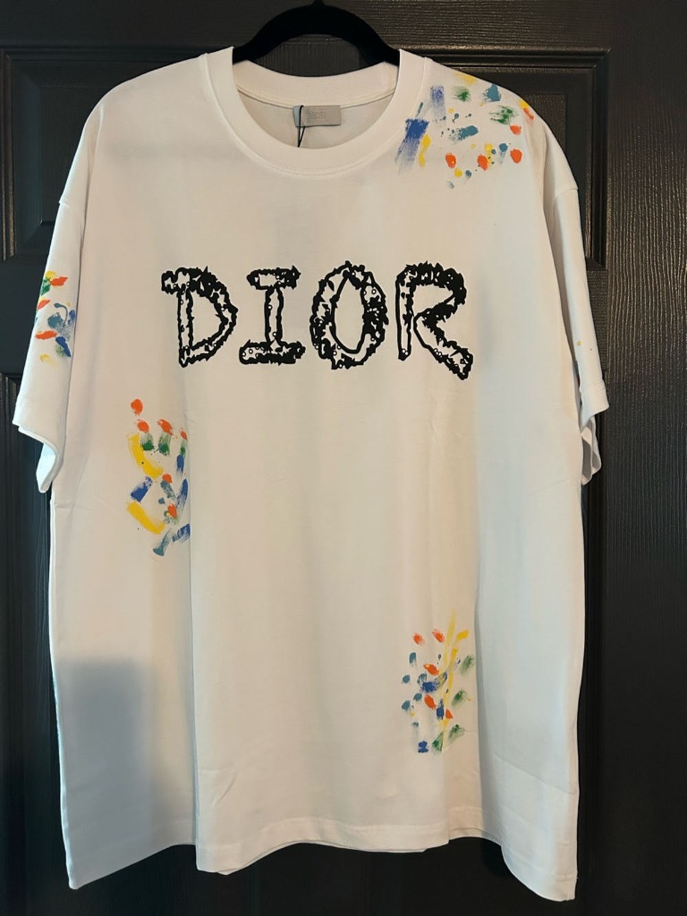 White Tee with Black Logo and Blue & Yellow Paint Accents